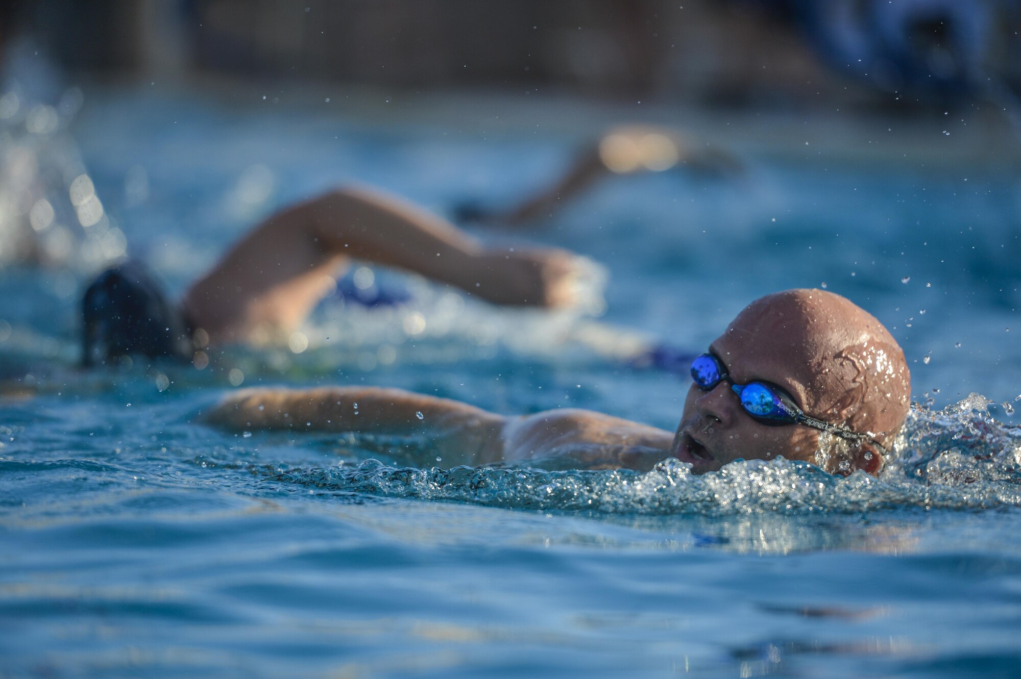 A Team Luke triathlon participant swims during the Luke Triathlon held at Luke Air Force Base, Ariz., Aug. 19, 2017. Athletes participating in the triathlon had to swim a total of 400 meters before moving onto the next segment of the competition. (U.S. Air Force photo/Airman 1st Class Caleb Worpel)