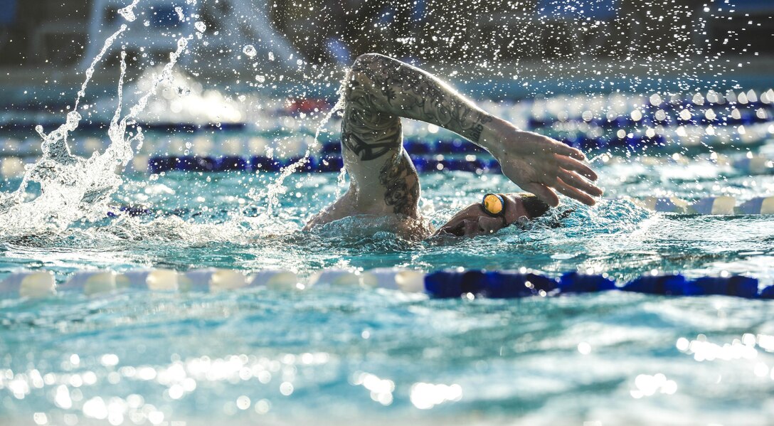 A Team Luke triathlon participant swims during the Luke Triathlon at Luke Air Force Base, Ariz., Aug. 19, 2017. Approximately 70 people participated in the event which included a 400 meter swim, 13 mile bike ride and 3.1 mile run to cross the finish line. (U.S. Air Force photo/Airman 1st Class Caleb Worpel)