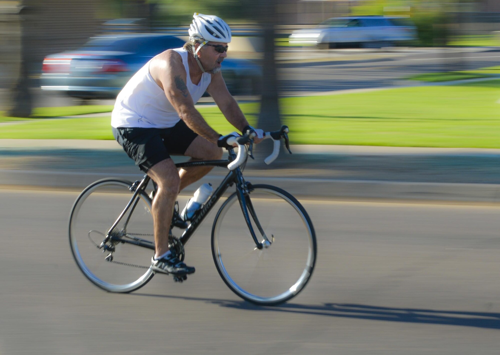 A Team Luke triathlon participant rides his bike during the Luke Triathlon held at Luke Air Force Base, Ariz., Aug. 19, 2017. The biking portion of the competition encompassed a total distance of 13 miles. (U.S. Air Force photo/Airman 1st Class Caleb Worpel)