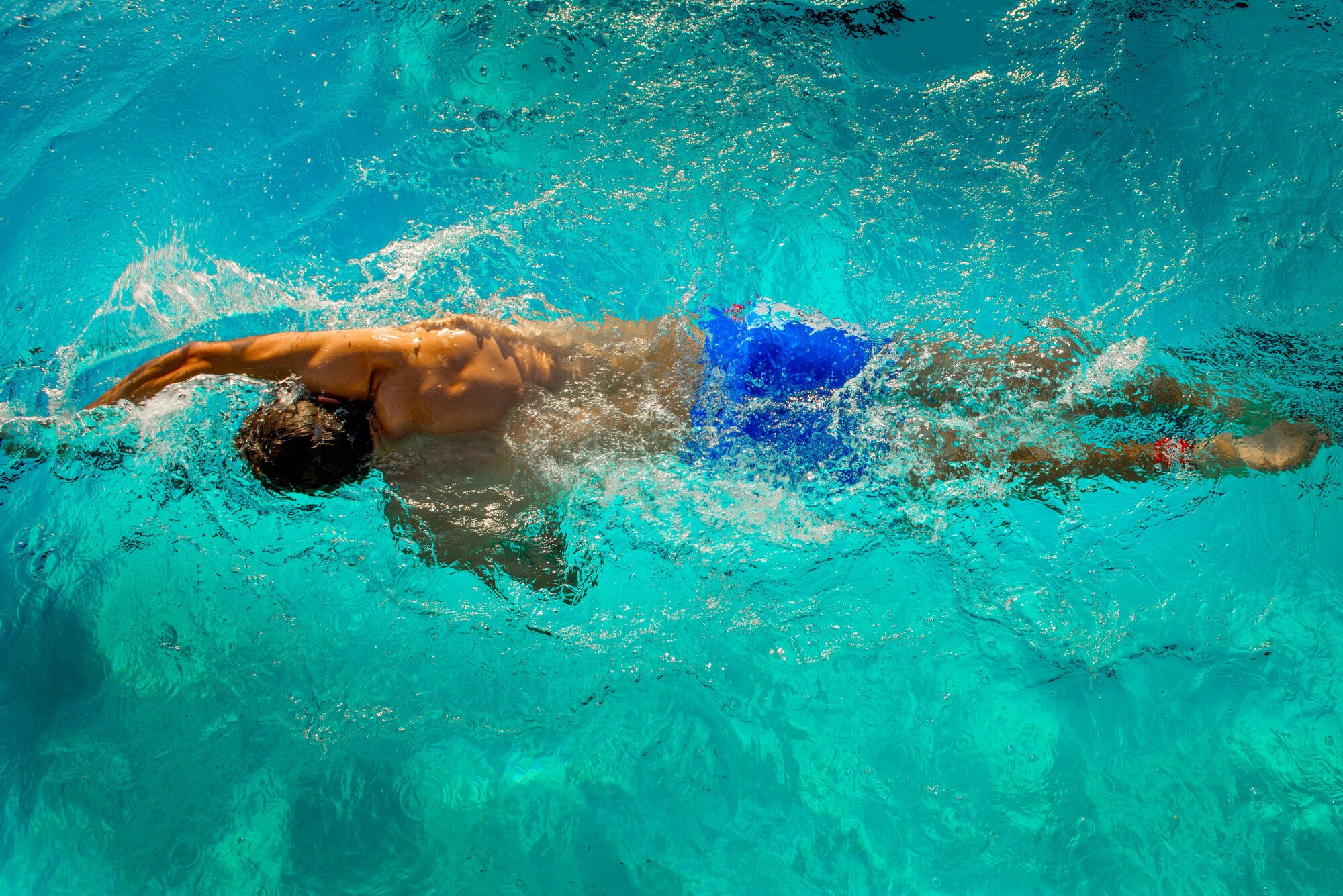 A Team Luke triathlon participant swims a portion of the Luke Triathlon held at Luke Air Force Base, Ariz., Aug. 19, 2017. Athletes swam 400 meters, biked 13 miles and ran 3.1 miles to finish the competition. (U.S. Air Force photo/Staff Sgt. Jensen Stidham)