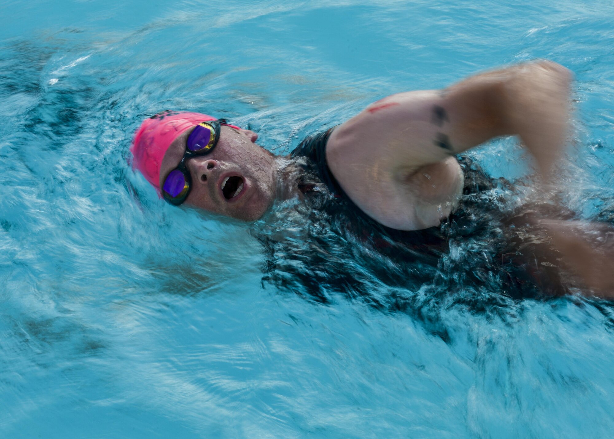A Team Luke triathlon participant swims during the Luke Triathlon held at Luke Air Force Base, Ariz., Aug. 19, 2017. Athletes swam 400 meters, biked 13 miles and ran 3.1 miles to finish the competition.  (U.S. Air Force photo/Airman 1st Class Caleb Worpel)