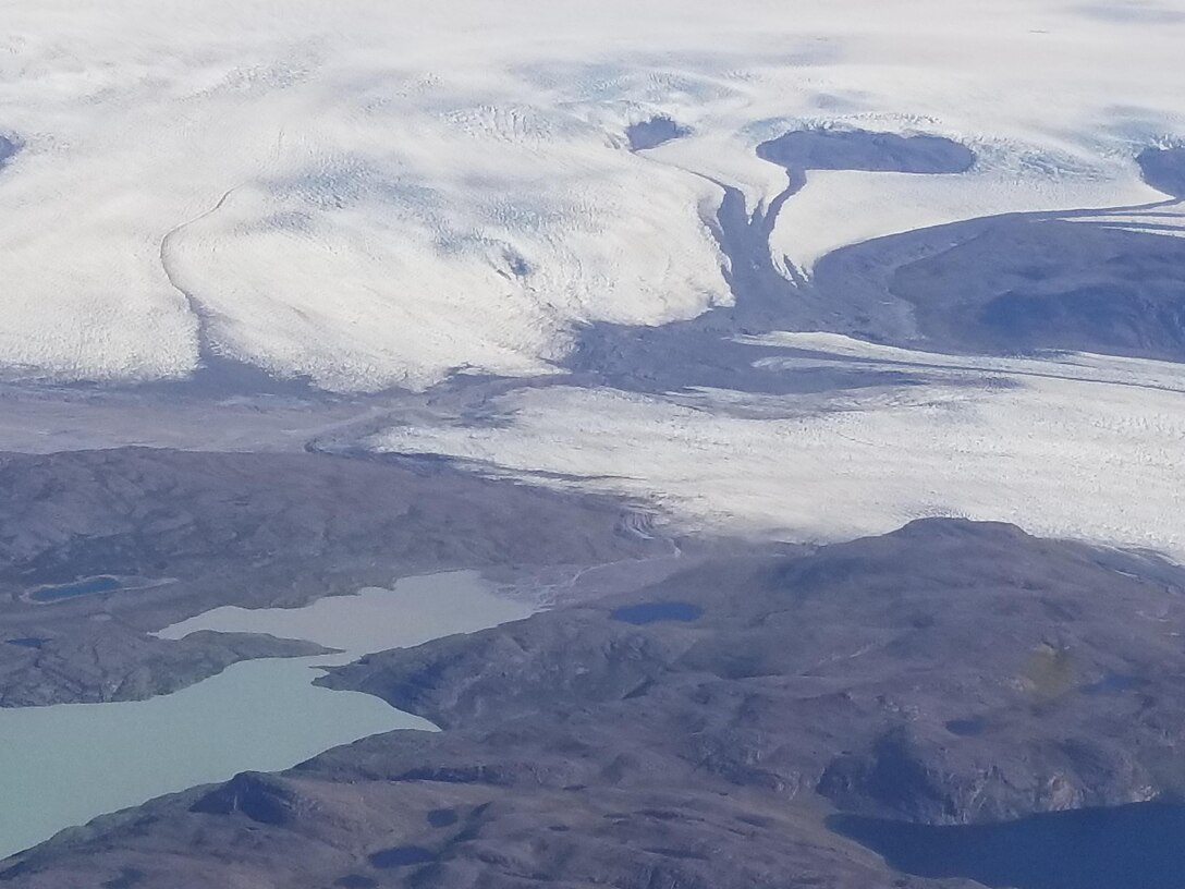 Picture of Greenland as members of the 103rd Rescue Squadron of the 106th Rescue Wing and members of the 109th Airlift Wing assigned to the New York Air National Guard, survey Greenland’s terrain July 22, 2017. Pararescuemen from the 106 RQW and aircrews from 109th Airlift Wing met prior to traveling to Greenland to discuss mission capabilities and ways the wings could benefit from one another. (U.S. Air Force photo by Lt. Col. Kerry McCauley)