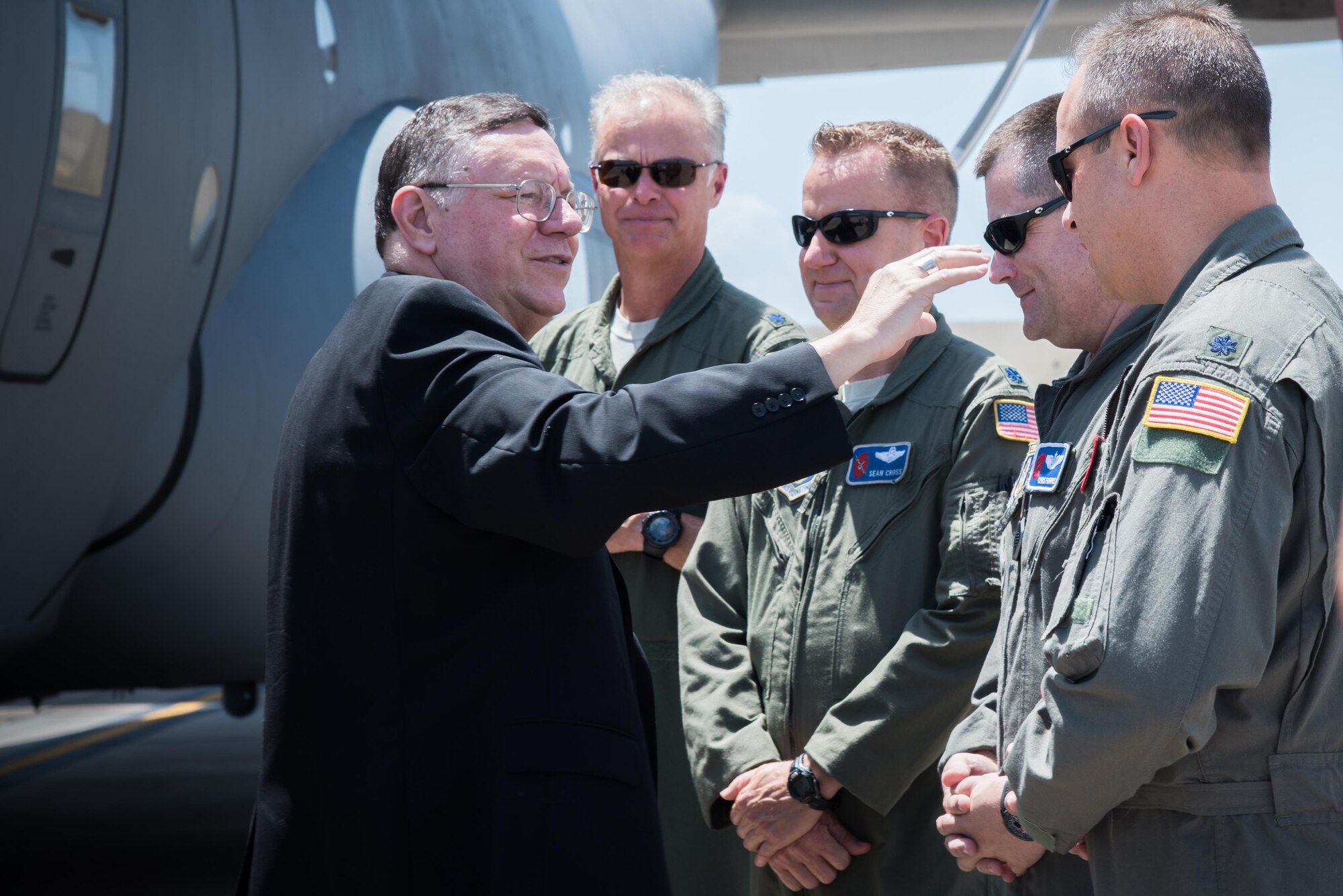 The Bishop of Biloxi, Bishop Louis Kihneman, blesses the 403rd Wing's fleet of aircraft Aug. 17, 2017 at Keesler Air Force Base, Mississippi. Kihneman visited the 403rd Wing to learn more about its mission. (U.S. Air Force photo/Staff Sgt. Heather Heiney)