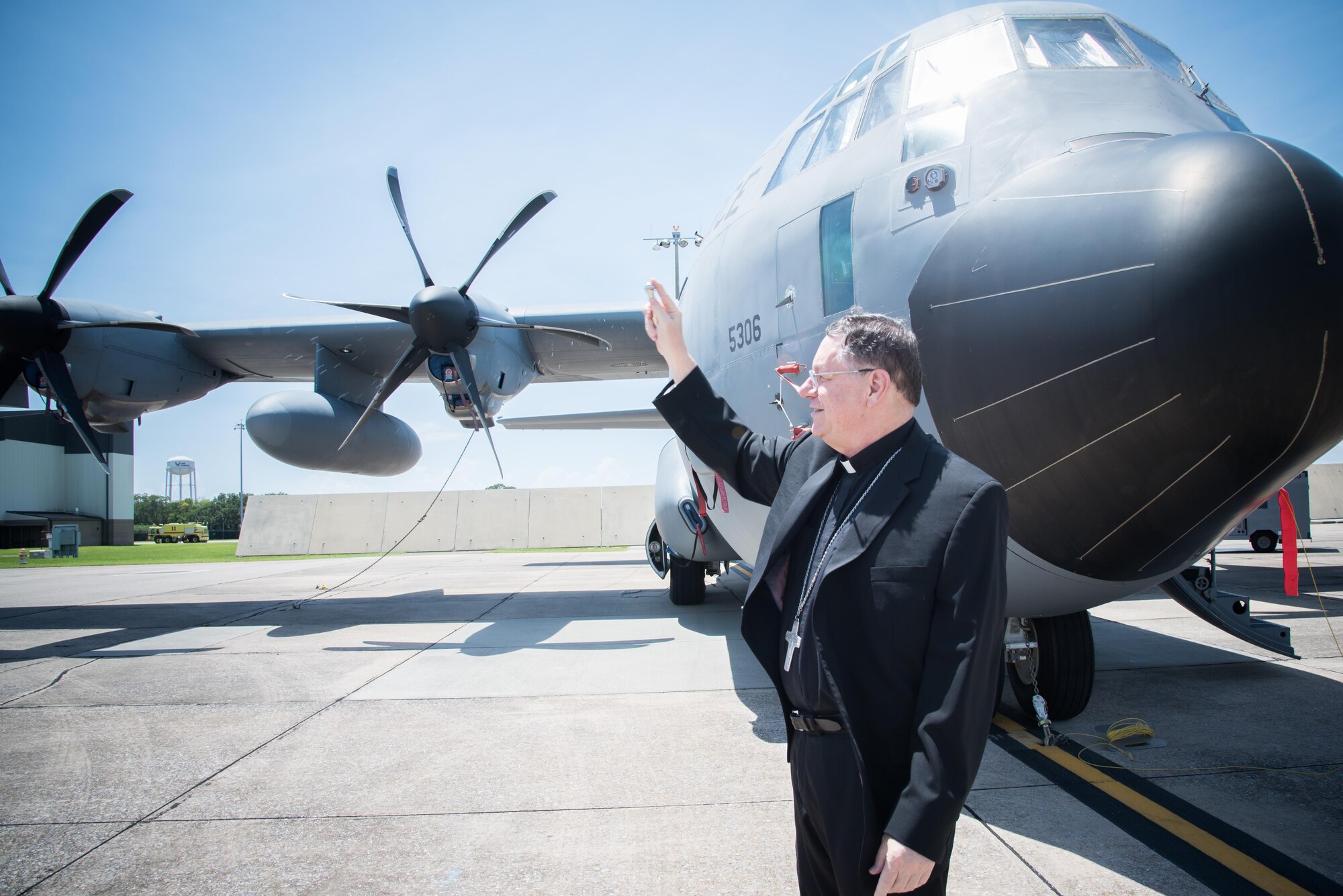 The Bishop of Biloxi, Bishop Louis Kihneman, blesses the 403rd Wing's fleet of aircraft Aug. 17, 2017 at Keesler Air Force Base, Mississippi. Kihneman visited the 403rd Wing to learn more about its mission. (U.S. Air Force photo/Staff Sgt. Heather Heiney)