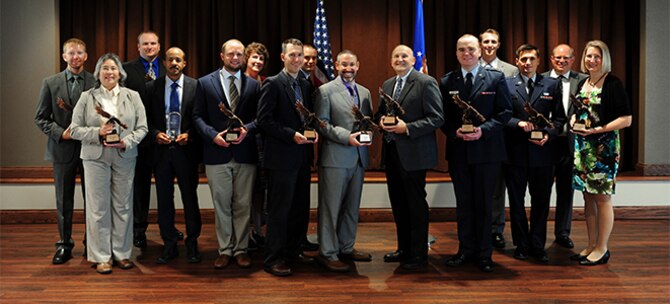 National Air and Space Intelligence Center Commander's Award for Merit winners pose for a group photo, Aug. 15, 2017.  NASIC recognized top performers including the Major General Watson award and Wall of Honor inductees. U.S. Air Force photo by Staff Sgt. Stephanie Longoria)