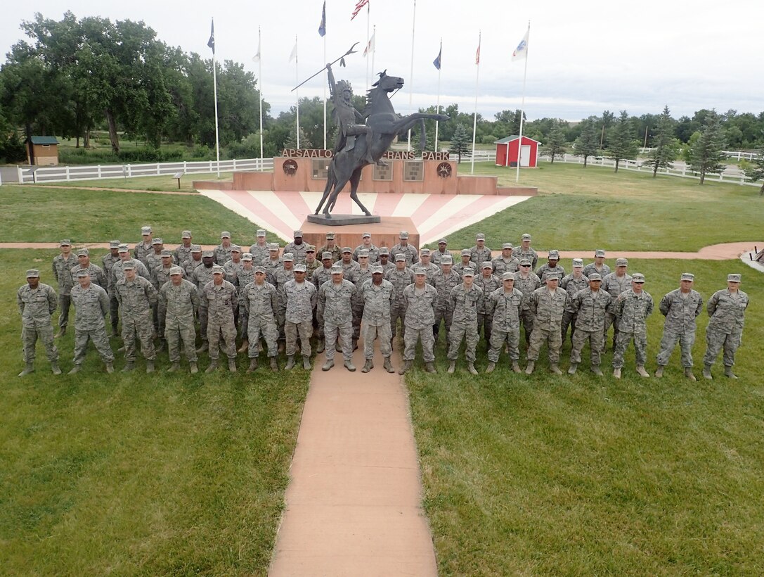 Group photo of the 106th Rescue Wing Civil Engineering members assigned to the New York Air National Guard at Crow Agency, Montana June 16, 2017. 32 members from the New York Air National Guard’s 106th Rescue Wing’s Civil Engineer Squadron and five members from the 106th Force Support Squadron, here, deployed for training June 4 to June 17, 2017, at Crow Agency, Montana, in an effort to build and renovate homes for military service veterans from the Native American tribe Crow Nation. (U.S. Air Force photo by Senior Airman Vincent Naimo)