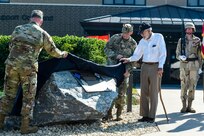 The ground rumbled, the glass shook, and the air became thick with smoke as cannons fired a 21-gun salute to commemorate the 100th anniversary of the 88th Regional Support Command, here, at Fort McCoy, Wisconsin.