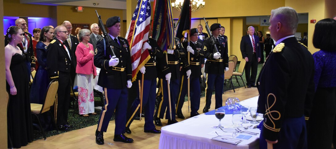 The 88th Blue Devil Color Guard renders honors during an 88th RSC Headquarters and Headquarters Company banquet in Warrens, Wis. on Aug. 19, in honor of the 100 Year Anniversary of the establishment of the 88th Division.