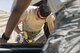 U.S. Air Force Senior Airman Callum Carins, 307th Civil Engineer Squadron, Barksdale AFB, La., cuts a piece of plywood to build a box for storing power cords during  exercise Patriot Warrior at Young Air Assault Strip, Fort McCoy, Wis., Aug. 9, 2017.