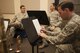 U. S. Air Force Airman 1st Class Lee Jarzembak, a tuba player for the United States Air Force Band of the Golden West, jots down a note on a sheet of music during a Travis Brass Quintet rehearsal Aug. 7, 2017 at Travis Air Force Base, Calif. One of the cornerstone ensembles for the Band of the Golden West, Travis Brass has been delighting audiences in the Western U.S. for several decades. The brass quintet is made up of two trumpets, a horn, a trombone and a tuba. (U.S. Air Force photo/ Heide Couch)