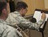 U. S. Air Force Airman First Class Alan Matteri, a trumpet player for the United States Air Force Band of the Golden West, jots down a note on a sheet of music during a Travis Brass Quintet rehearsal, Aug. 7, 2017, Travis Air Force Base, Calif. One of the cornerstone ensembles for the U. S. Band of the Golden West, Travis Brass has been delighting audiences in the Western U.S. for several decades. The brass quintet is made up of two trumpets, a horn, a trombone and a tuba.