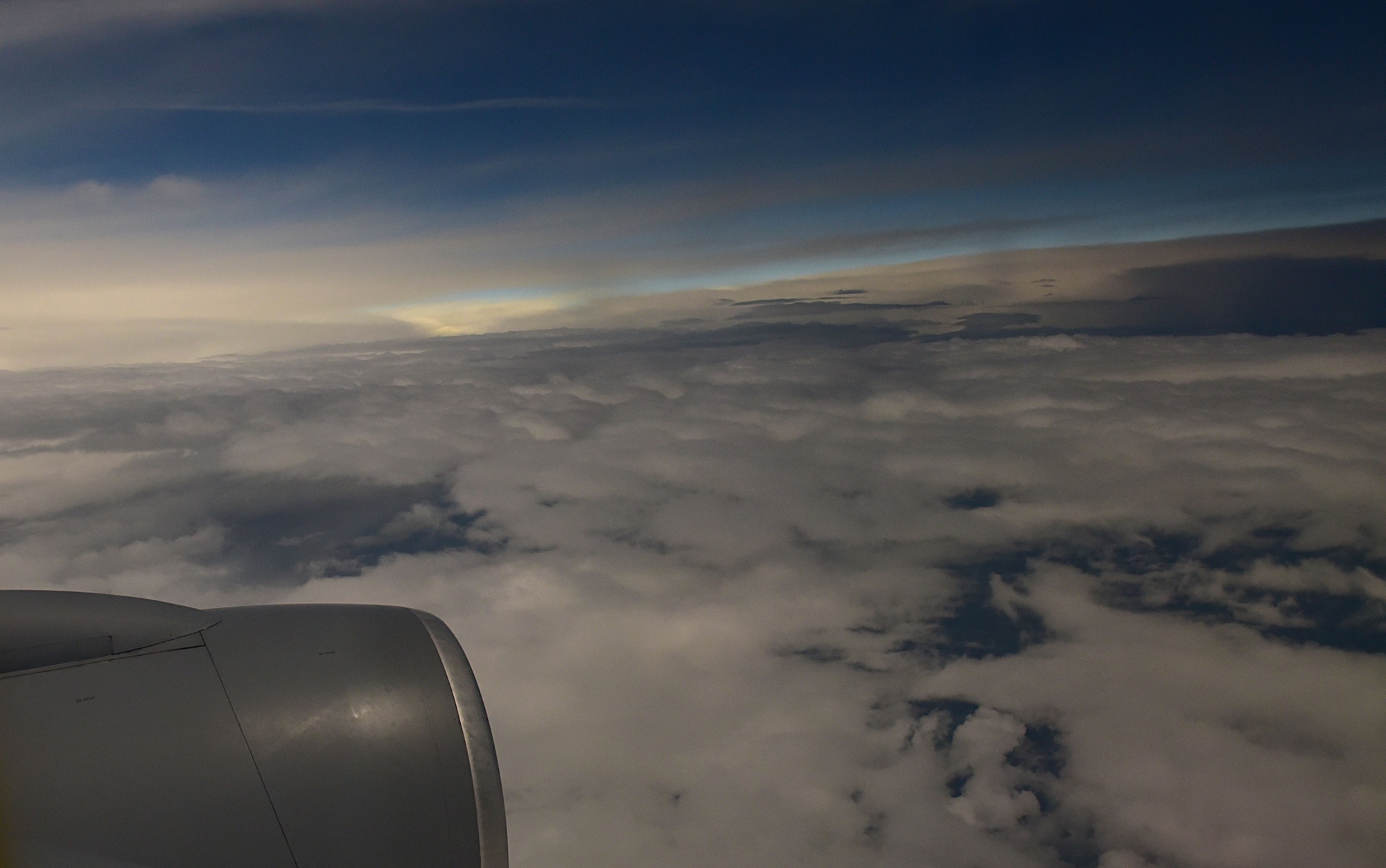 A KC-135 Stratotanker assigned to McConnell Air Force Base, Kan. flies through clouds during the solar eclipse, Aug. 21, 2017, in the path of totality. McConnell Airmen train to deliver combat aerial refueling no matter the weather. (U.S. Air Force photo/Staff Sgt. Trevor Rhynes)