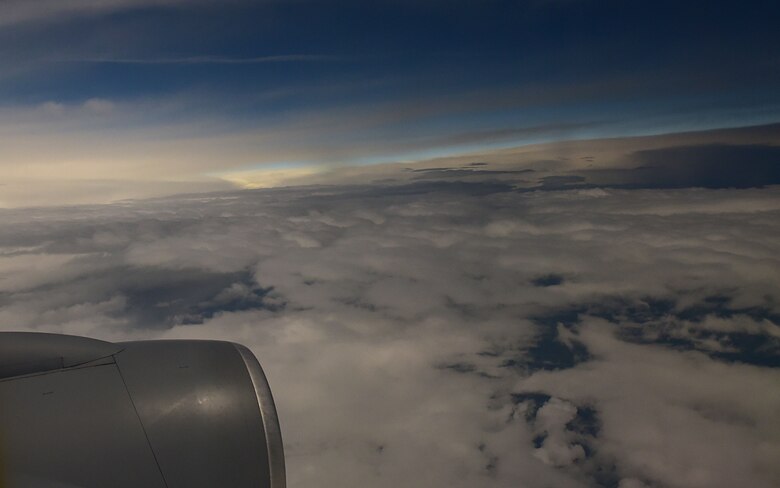 A KC-135 Stratotanker assigned to McConnell Air Force Base, Kan. flies through clouds during the solar eclipse, Aug. 21, 2017, in the path of totality. McConnell Airmen train to deliver combat aerial refueling no matter the weather. (U.S. Air Force photo/Staff Sgt. Trevor Rhynes)