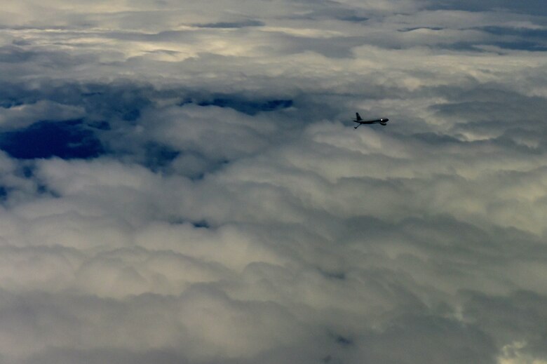 Two KC-135 Stratotankers assigned to McConnell Air Force Base, Kan. fly in formation during the solar eclipse Aug. 21, 2017, in the path of totality. McConnell is home to one of the largest tanker fleets in the Air Force. (U.S. Air Force photo/Staff Sgt. Trevor Rhynes)
