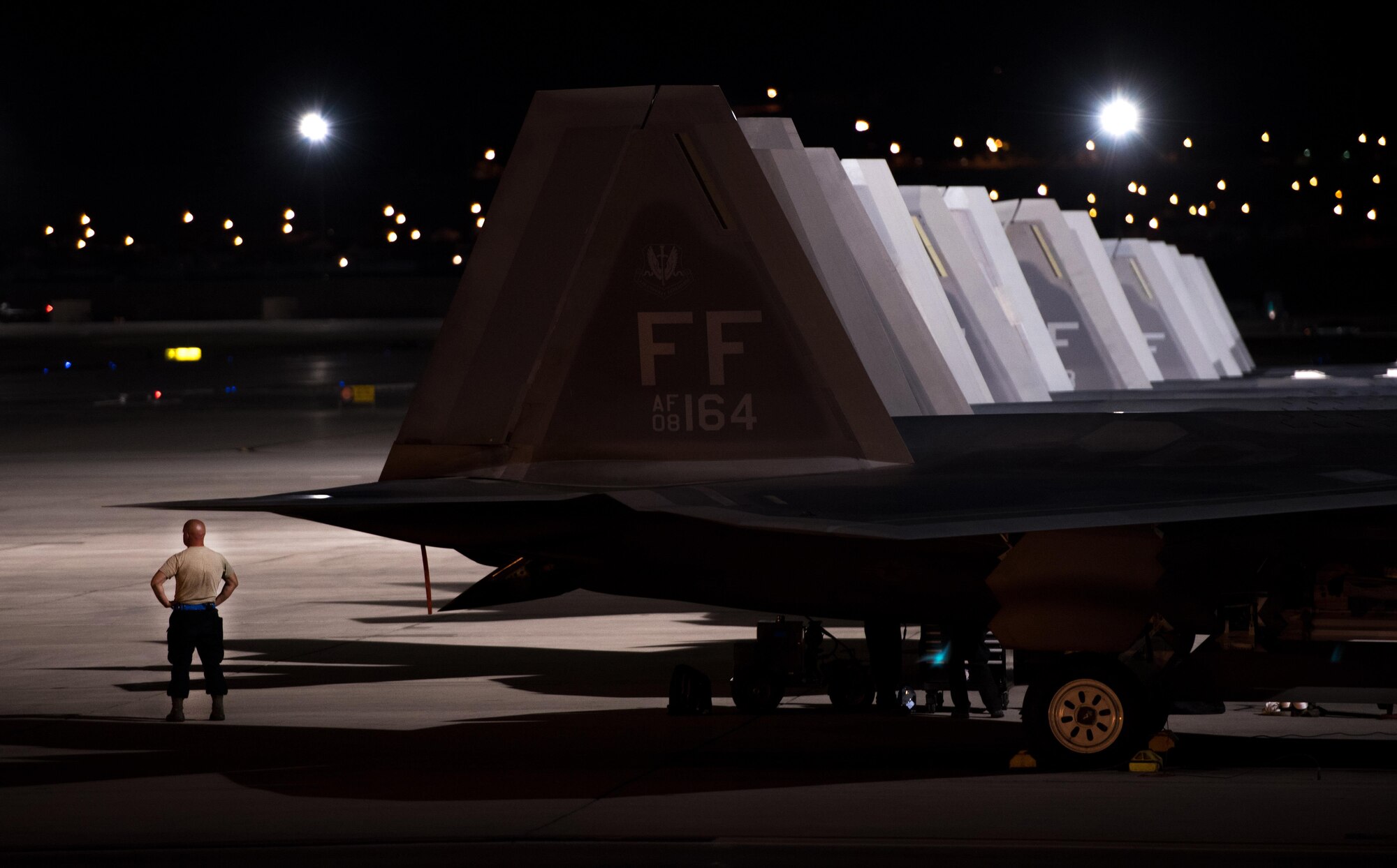 U.S. Air Force Staff Sgt. Courtney Puyear, 94th Aircraft Maintenance Unit crew chief awaits 94th Fighter Squadron pilots to arrive to their jets for Red Flag 17-4 at Nellis Air Force Base, Nev., Aug. 21, 2017. The 94th FS is currently deployed to Red Flag 17-4, taking part in an multi-dimensional simulated air and ground combat environment. (U.S. Air Force photo by Staff Sgt. Carlin Leslie)