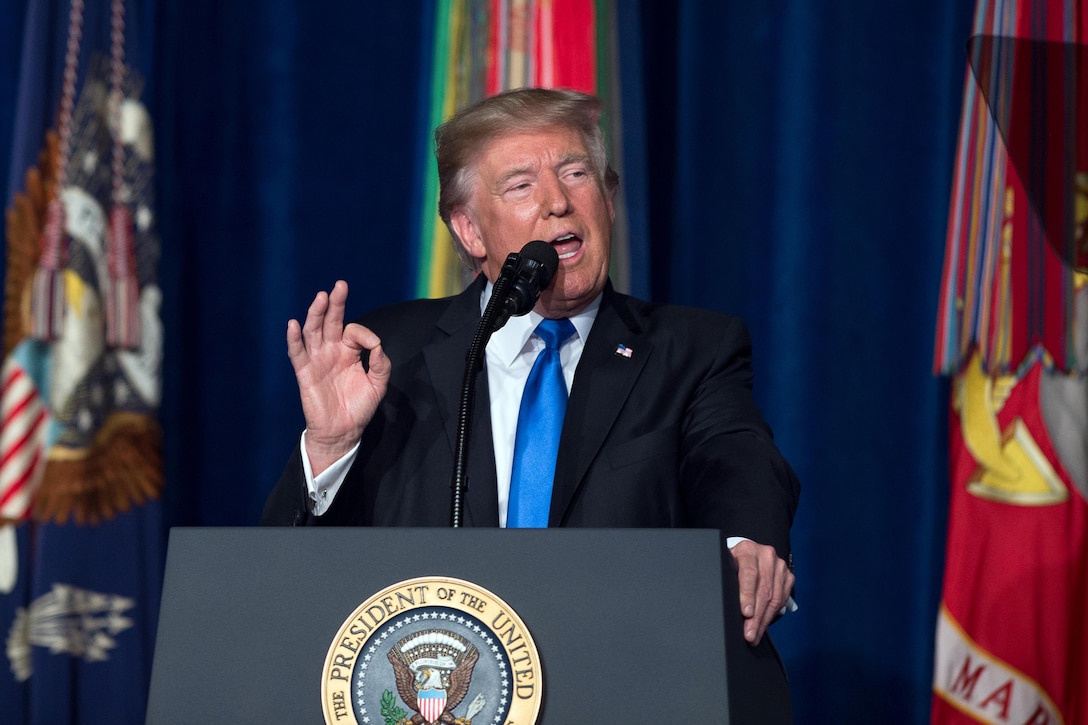 President Donald J. Trump speaks at a podium.