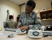 U.S Air Force Senior Airman Dalicia Brenson, an engineering technician with the 379th Expeditionary Civil Engineer Squadron, assembles a Trimble GPS Land Surveying Equipment at Al Udeid Air Base, Qatar, July 25, 2017. The Trimble GPS Land Surveying Equipment helps Brenson and the engineering team to locate the exact coordinates and elevations for future construction projects.  (U.S. Air Force photo by Tech. Sgt. Amy M. Lovgren)