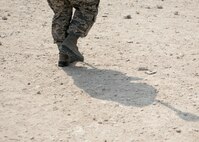 U.S Air Force Senior Airman Zamantha Tinio, expeditionary geobase manager with the 379th Expeditionary Civil Engineer Squadron, carries her Trimble GPS Land Surveying Equipment to a survey at Al Udeid Air Base, Qatar, Aug. 2, 2017. The Trimble GPS Land Surveying Equipment helps Tinio and the engineering team to locate the exact coordinates and elevations for future construction projects.  (U.S. Air Force photo by Tech. Sgt. Amy M. Lovgren)