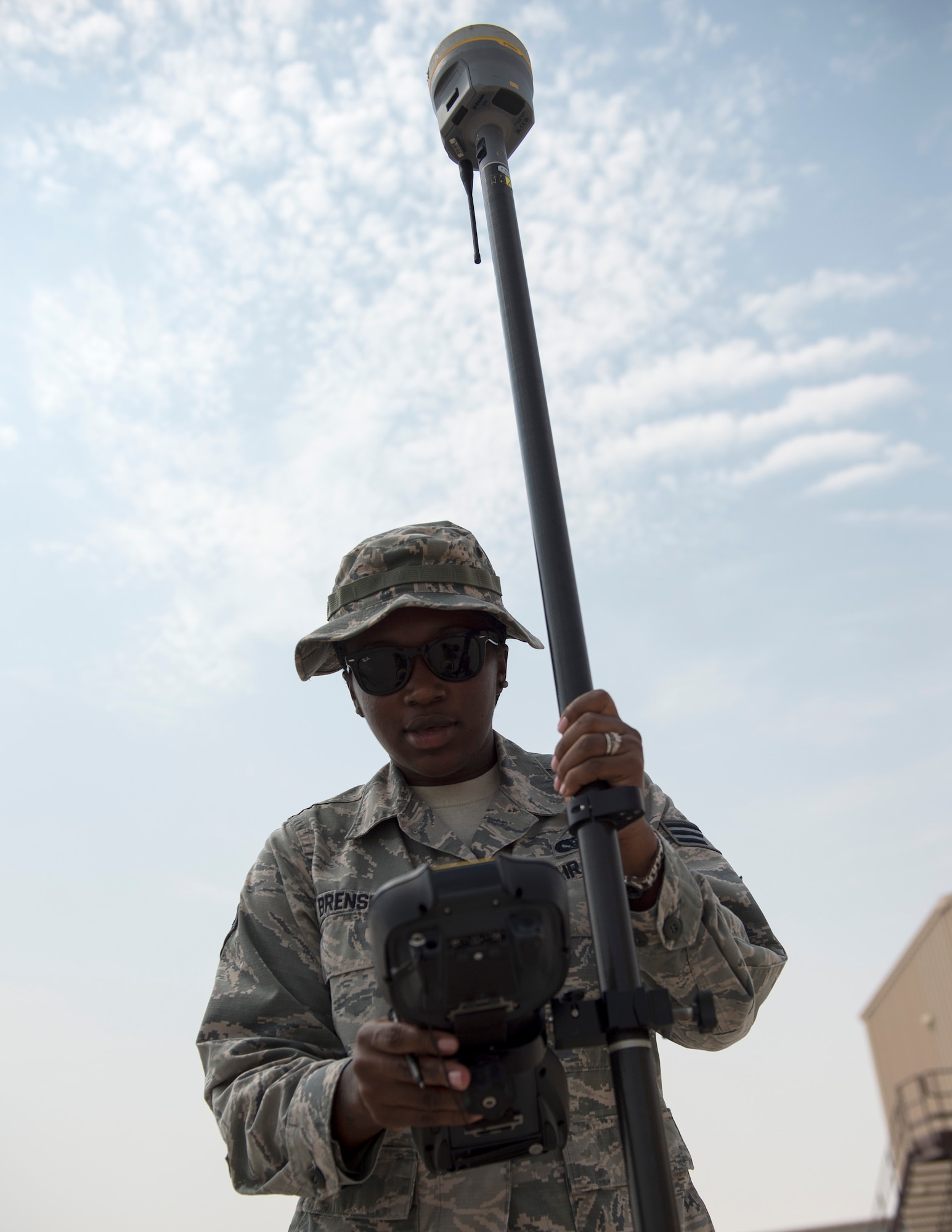 U.S Air Force Senior Airman Dalicia Brenson, an engineering technician with the 379th Expeditionary Civil Engineer Squadron, confirms the coordinate and elevation on the Trimble GPS Land Surveying Equipment at Al Udeid Air Base, Qatar, Aug. 2, 2017.