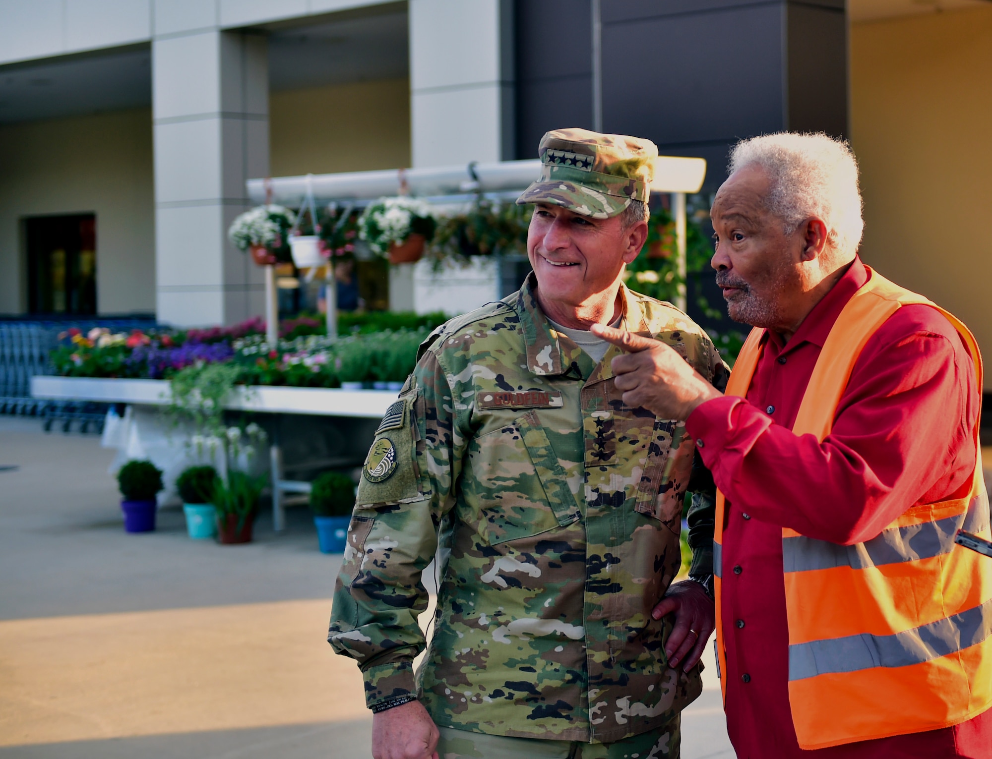 Air Force Chief of Staff Gen. David L. Goldfein listens to Charlie Searchwell, commissary head bagger, on Ramstein Air Base, Germany, Aug. 21, 2017. As a teenager, Gen. Goldfein worked with Searchwell as a bagger at the Ramstein commissary. Searchwell has worked at the commissary for nearly 50 years and has known Goldfein for more than 40 years. The CSAF passed through Ramstein on his way back to the states after visiting Airmen at various locations throughout the Middle East.