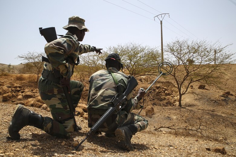 Soldiers with Senegal’s 5th Contingent in Mali locate a potential improvised explosive device indicator during a peacekeeping operations training mission alongside U.S. Marines with Special Purpose Marine Air-Ground Task Force – Crisis Response – Africa at Thies, Senegal, June 6, 2017. Marines and Sailors with SPMAGTF-CR-AF served as instructors and designed the training to enhance the soldiers’ abilities to successfully deploy in support of United Nations peacekeeping missions in the continent. (U.S. Marine Corps photo by Sgt. Samuel Guerra/Released)