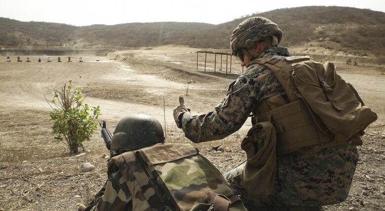 Cpl. Seth Carney, a rifleman with Special Purpose Marine Air-Ground Task Force – Crisis Response – Africa, coaches a soldier with Senegal’s 5th Contingent in Mali through an unknown distance range course of fire during a peacekeeping operations training mission at Thies, Senegal, June 9, 2017. Marines and Sailors with SPMAGTF-CR-AF served as instructors and designed the training to enhance the soldiers’ abilities to successfully deploy in support of United Nations peacekeeping missions in the continent. (U.S. Marine Corps photo by Sgt. Samuel Guerra/Released)
