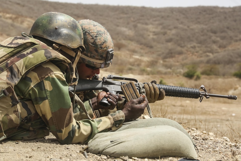 Cpl. Hayden Garrett, a rifleman with Special Purpose Marine Air-Ground Task Force – Crisis Response – Africa, coaches a soldier with Senegal’s 5th Contingent in Mali through remedial action of the M16A2 rifle during a peacekeeping operations training mission at Thies, Senegal, June 9, 2017. Marines and Sailors with SPMAGTF-CR-AF served as instructors and designed the training to enhance the commandos’ abilities to successfully deploy in support of United Nations peacekeeping missions in the continent. (U.S. Marine Corps photo by Sgt. Samuel Guerra/Released)