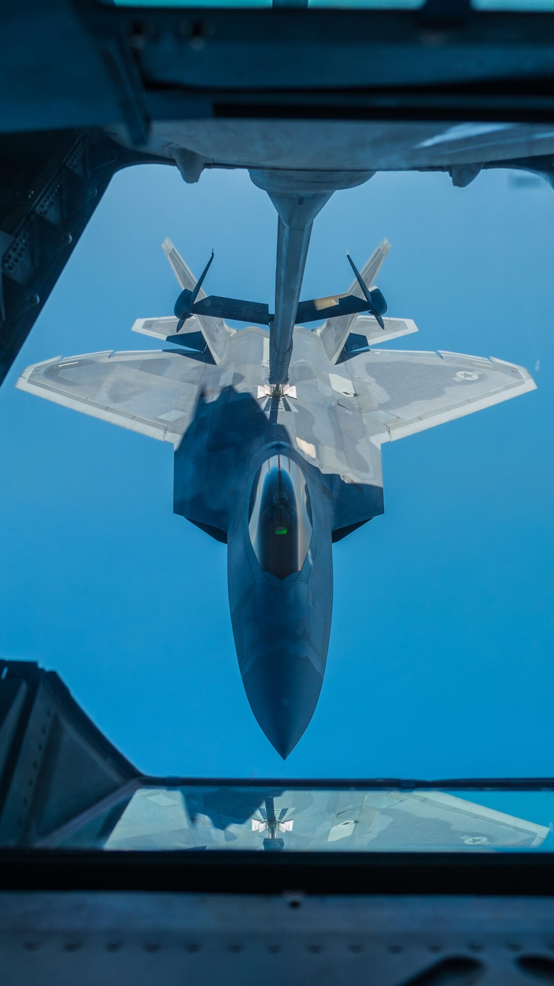 A 27th Expeditionary Fighter Squadron pilot flies an F-22 Raptor up to a 908th Expeditionary Air Refueling Squadron KC-10 Extender Aug. 22, 2017, in the skies over southwest Asia.