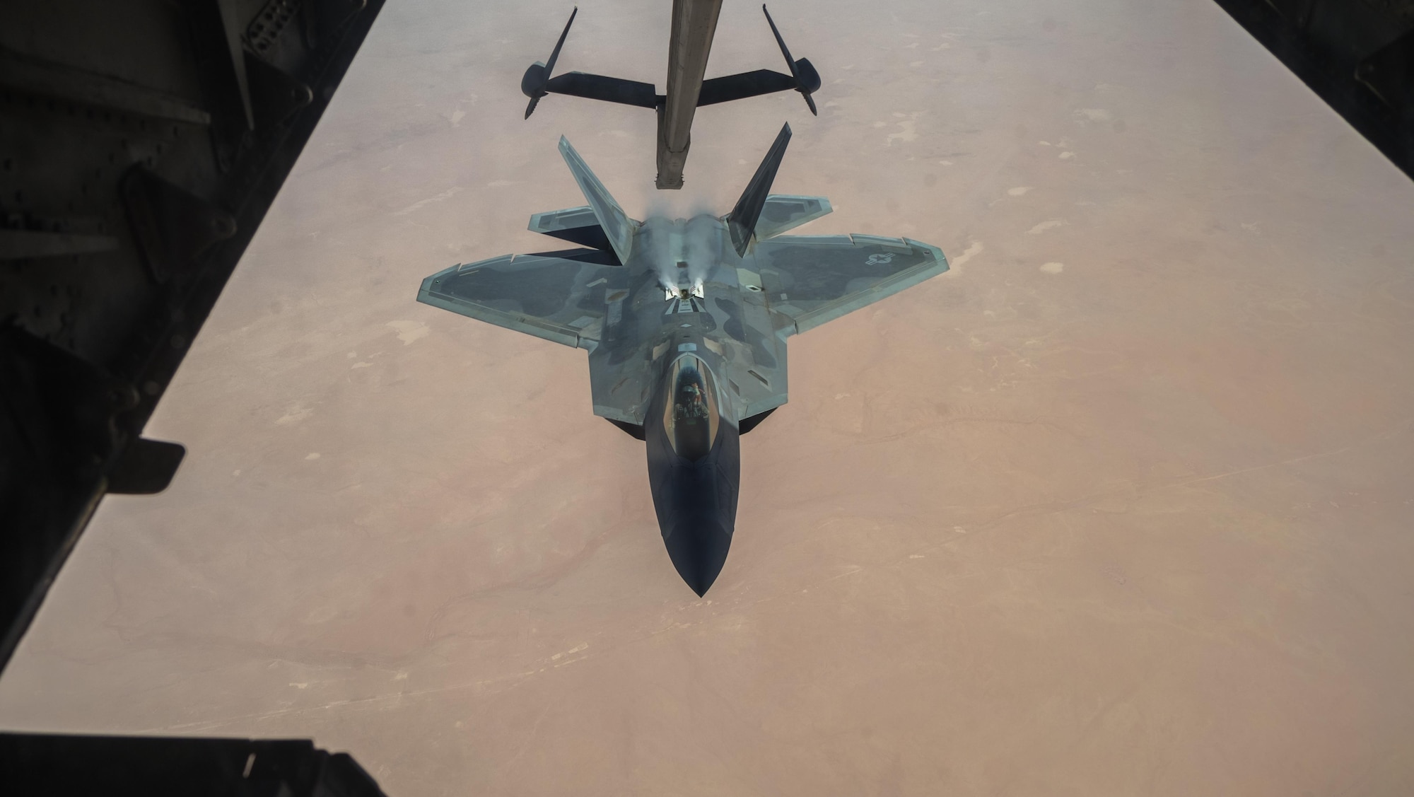 A 27th Expeditionary Fighter Squadron pilot disengages an F-22 Raptor from the boom of a 908th Expeditionary Air Refueling Squadron KC-10 Extender Aug. 22, 2017, in the skies over southwest Asia.