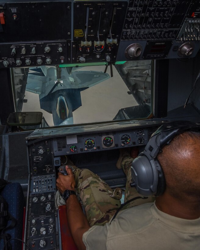 Master Sgt. Kingsley, 908th Expeditionary Air Refueling Squadron boom operator, refuels a 27th Expeditionary Fighter Squadron F-22 Raptor from a KC-10 Extender Aug. 22, 2017, in the skies over southwest Asia.
