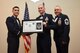 U.S. Air Force Tech. Sgt. Jeffrey Trueman, 312th Training Squadron, receives their certificate of selection from Col. Ricky Mills, 17th Training Wing commander, and Chief Master Sgt. Daniel Stein, 17th Training Group superintendent, during the Senior NCO Induction Ceremony at the Event Center on Goodfellow Air Force Base, Texas, Aug. 18, 2017. (U.S. Air Force photo by Airman 1st Class Chase Sousa/Released)