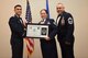 U.S. Air Force Tech. Sgt. Jessica Turner, 17th Force Support Squadron, receives their certificate of selection from Col. Ricky Mills, 17th Training Wing commander, and Chief Master Sgt. Daniel Stein, 17th Training Group superintendent, during the Senior NCO Induction Ceremony at the Event Center on Goodfellow Air Force Base, Texas, Aug. 18, 2017. (U.S. Air Force photo by Airman 1st Class Chase Sousa/Released)