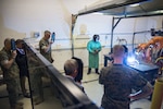 Image: leaders in additive manufacturing watch a welding display