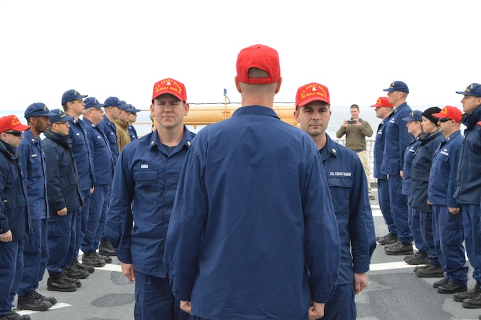 HEALY’s crew and the 1701 science crew assemble on the flight deck for a group photograph.