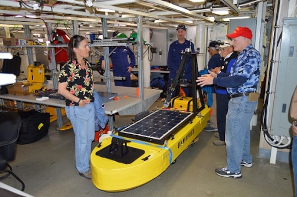CAPT Tlapa and Chief Scientist explain some of the unmanned maritime systems HEALY tested in the Arctic to the Mayor of Nome and local tribal representatives.