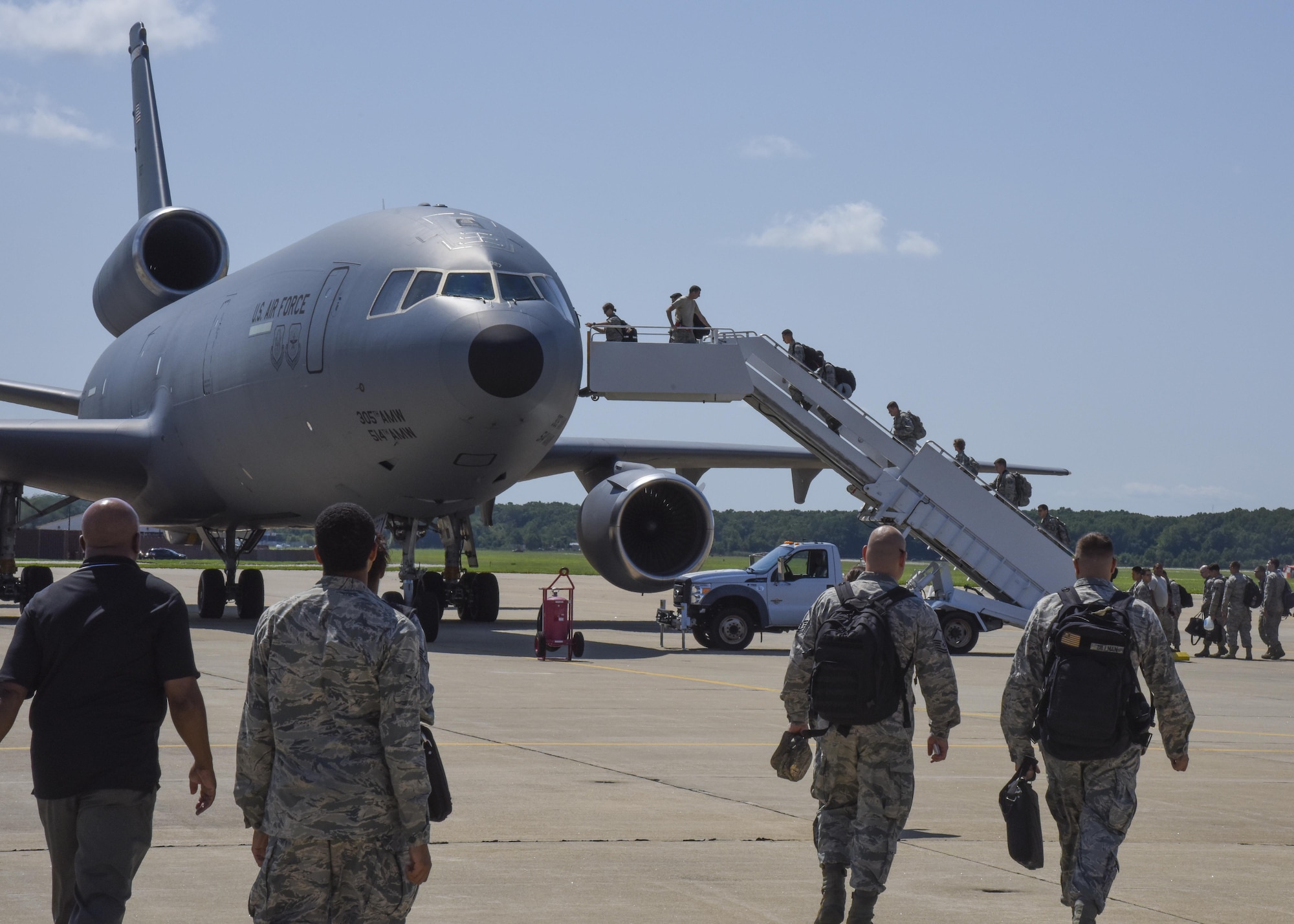 U.S. Air Force Airmen deploying, board a KC-10 Extender at Joint Base Langley-Eustis, Va., Aug. 10, 2017.