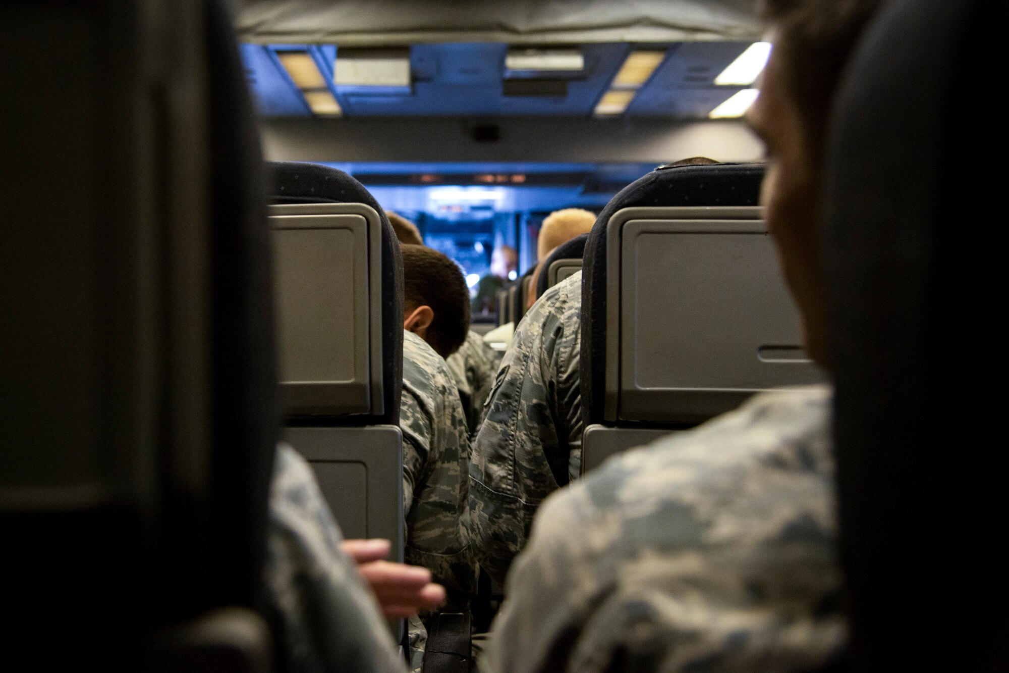 Airmen from the 23d Maintenance Group wait for takeoff aboard a KC-10 Extender, Aug. 19, 2017, at Moody Air Force Base, Ga. The Airmen were travelling to Nellis Air Force Base, Nev., to support the Weapons Instructor Course, which trains tactical experts and leaders to control and exploit air, space and cyberspace. (U.S. Air Force photo by Airman 1st Class Erick Requadt)