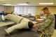 Airman 1st Class Wyatt Weaver, 56th Operation Support Squadron aircrew flight equipment journeyman, conducts an inflation test August 18, 2017, at Luke Air Force Base, Ariz. The water proof suit is used to protect pilots from cold temperatures. (U.S. Air Force photo/Airman 1st Class Pedro Mota)