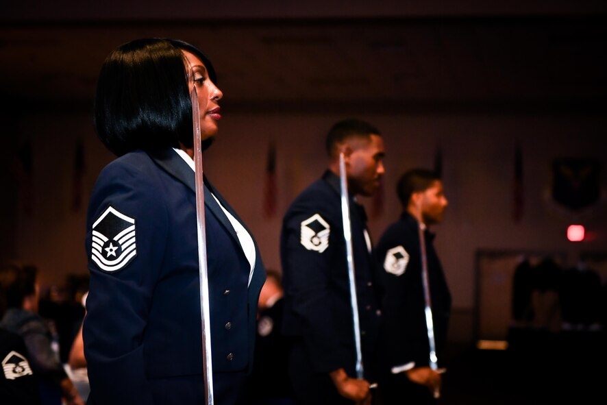 Barksdale master sergeants perform a saber arch during the 2017 Senior NCO induction ceremony at Barksdale Air Force Base, La., Aug. 18. The saber team consisted of six members, all master sergeants keeping up with the theme of the event.