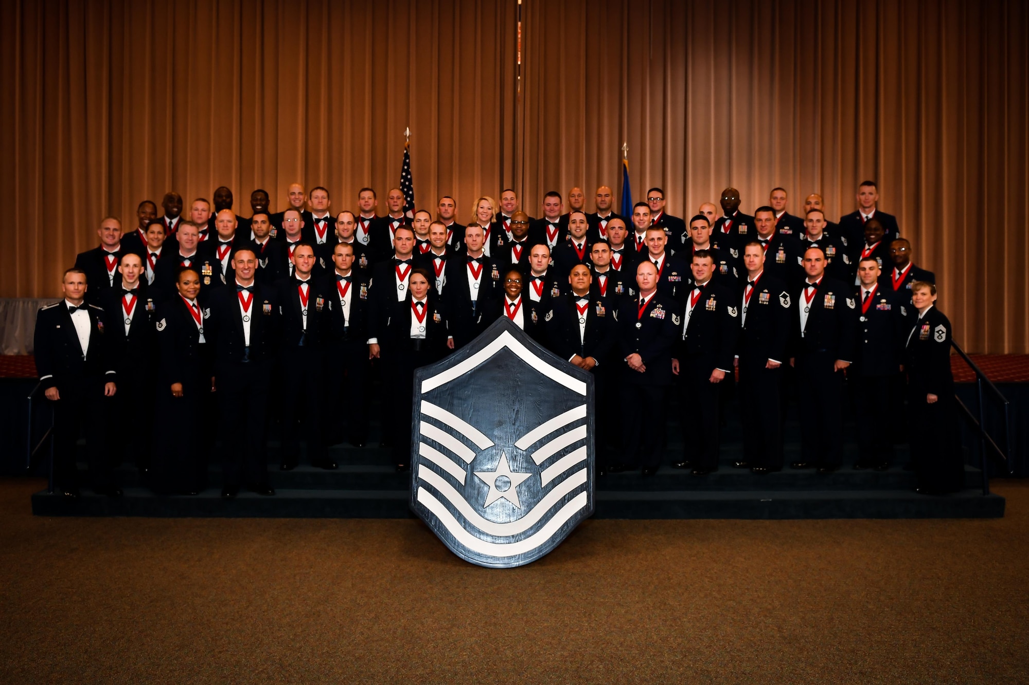 Attendees pose for a group photo during the 2017 Senior NCO induction ceremony at Barksdale Air Force Base, La., Aug. 18. The ceremony was open to family members, co-workers, and leadership, including the inductees the event brought in over 300 guests.