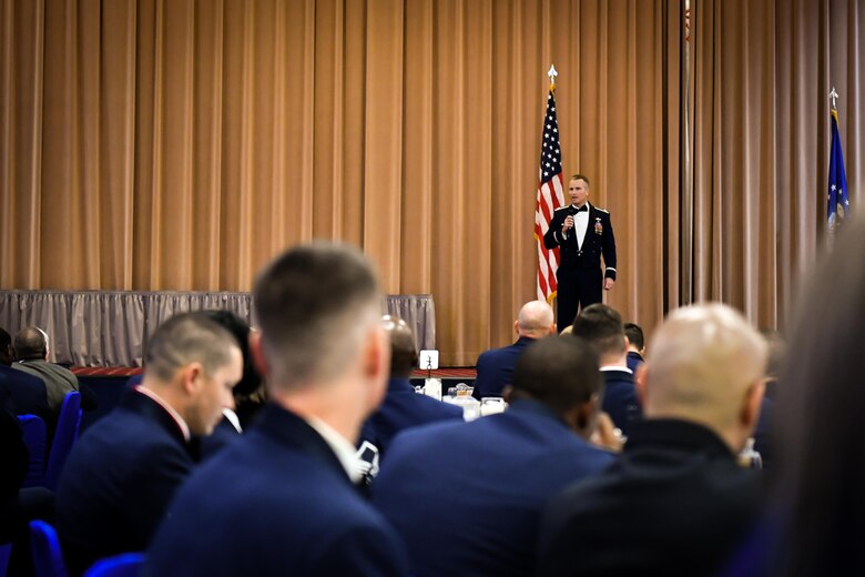 Col. Robert Makros, 2nd Bomb Wing vice commander, speaks to attendees during the 2017 Senior NCO induction ceremony at Barksdale Air Force Base, La., Aug. 18. Makros spoke to inductees about leadership and the balance between taking their families and their Airmen.