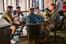 The Scott Air Force Base First Sergeant’s Group prepares a meal for dorm residents. The meals are prepared as part of the Dorm Dinner program, which provides dorm residents a home cooked meal and a chance to interact with different organizations on base.