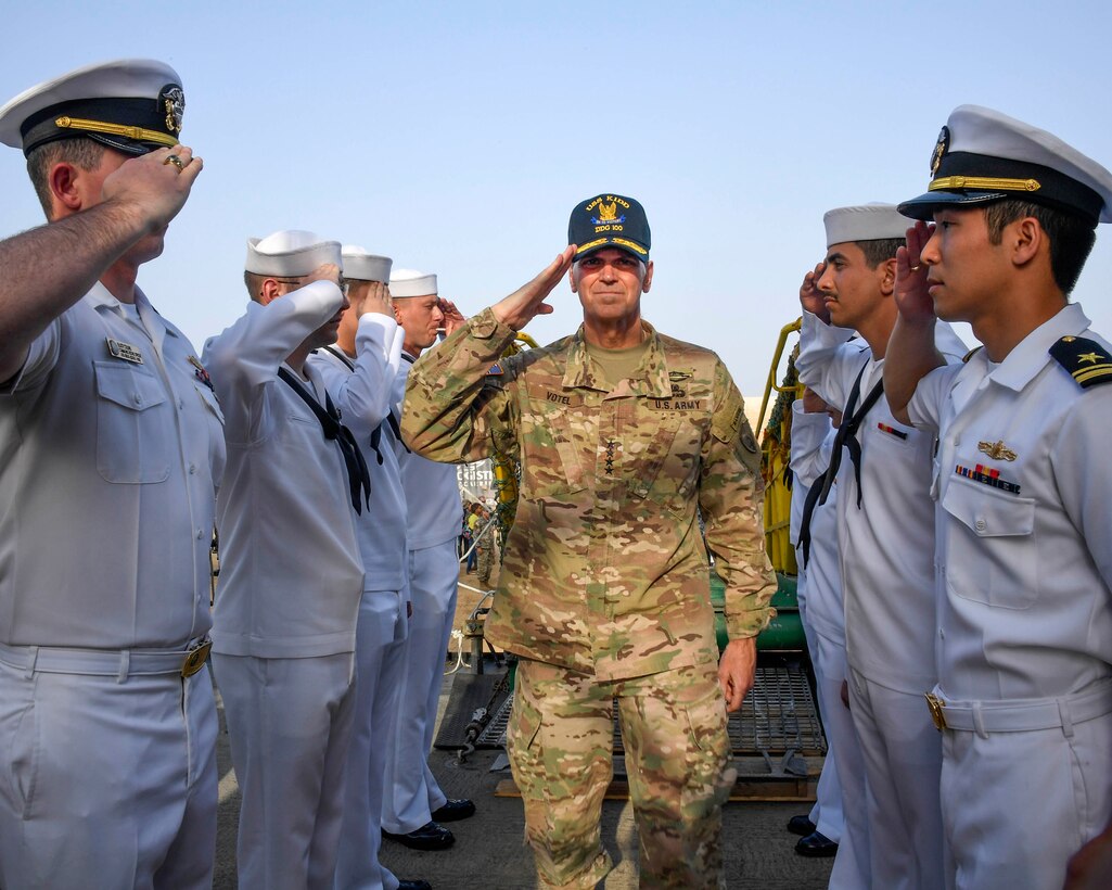 U.S. Army Gen Joseph L. Votel, commander United States Central Command, boards the USS Kidd (DDG 100) at the port of Duqm during his visit to Oman August 22, 2017. While there, Votel met with Omani leaders to discuss topics of mutual interest and the development of the port of Duqm. Votel also had the opportunity to visit Sailors docked at the port.  (Department of Defense photo by U.S. Air Force Tech Sgt. Dana Flamer)
