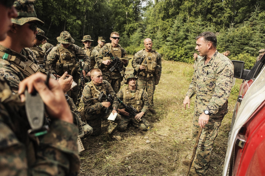 U.S. Marines with Super Squad Competition 3rd Squad, out of 3rd Battalion, 25th Marine Regiment, 4th Marine Division, Marine Forces Reserve, take notes during OPORDER brief before conducting a live-fire ambush range on Joint Base Elmendorf-Richardson, Alaska, Aug. 7, 2017.