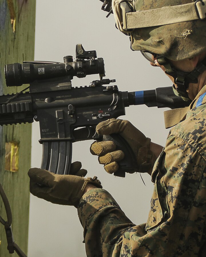 A U.S. Marine with 1st Battalion, 25th Marine Regiment, 4th Marine Division, Marine Forces Reserve and a member of 1st Squad seats a loaded magazine into his M4 Carbine while completing a timed live-fire range during the Combat Marksmanship Endurance Test in the Small Arms Complex on Joint Base Elmendorf-Richardson, Alaska, Aug. 8, 2017. The Marines and Sailors tested their abilities to conduct the full spectrum of infantry operations during the competition for the title of 4th Marine Division Super Squad. (U.S. Marine Corps photo by Sgt. Justin A. Bopp/Released)