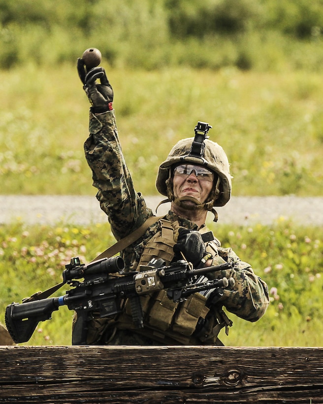 U.S. Marines with 1st Battalion, 25th Marine Regiment, 4th Marine Division, Marine Forces Reserve and members of 1st Squad conduct a timed grenade assault range during the Combat Marksmanship Endurance Test in the Small Arms Complex on Joint Base Elmendorf-Richardson, Alaska, Aug. 8, 2017.