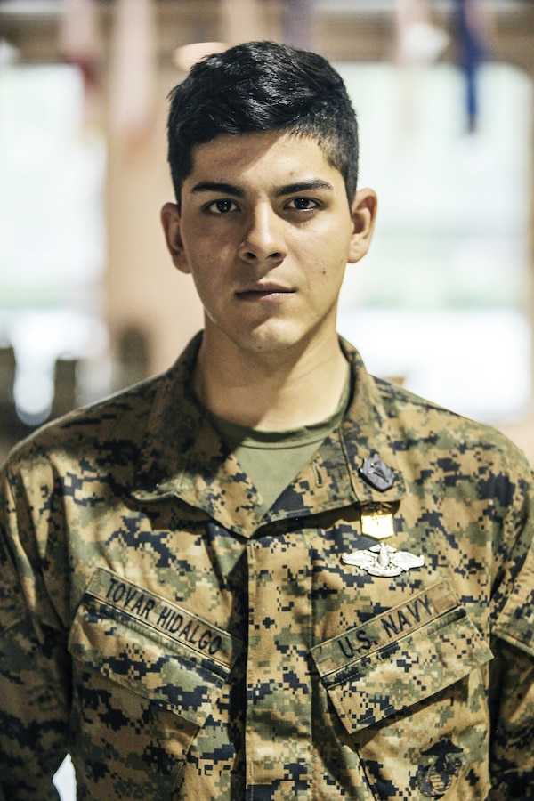 U.S. Navy Corpsman Petty Officer 3rd Class Daniel Tovar with 2nd Battalion, 23rd Marine Regiment, 4th Marine Division, Marine Forces Reserve and Squad Leader of 2nd Squad , stands at attention after recieving the Super Squad Badge during an awards ceremony on Joint Base Elmendorf-Richardson, Alaska, Aug. 9, 2017. Super Squad Competitions were designed to evaluate a 14-man infantry squad throughout an extensive field and live-fire evolution. (U.S. Marine Corps photo by Sgt. Justin A. Bopp/Released)