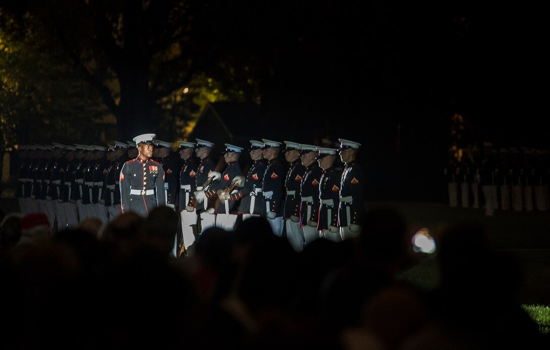 Marines of the U.S. Marine Corps Silent Drill Platoon execute their “long line” sequence during a Friday Evening Parade at Marine Barracks Washington D.C., Aug. 18, 2017. The guest of honor for the parade was the Superintendent of the U.S. Naval Academy, Vice Adm. Walter E. Carter, Jr., and the hosting official was the Deputy Commandant, Combat Development and Integration Commanding General, Marine Corps Combat Development Command, Lt. Gen. Robert S. Walsh. (Official Marine Corps photo by Lance Cpl. Damon McLean/Released)