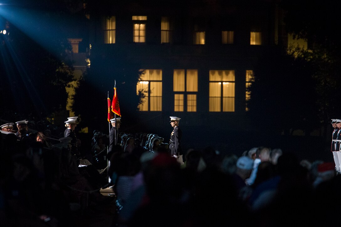 Captain Gregory J. Jurschak, platoon commander, U.S. Marine Corps Silent Drill Platoon, prepares to cut a salute during a Friday Evening Parade at the Barracks, Aug. 18, 2017. The guest of honor for the parade was the Superintendent of the U.S. Naval Academy, Vice Adm. Walter E. Carter, Jr., and the hosting official was the Deputy Commandant, Combat Development and Integration Commanding General, Marine Corps Combat Development Command, Lt. Gen. Robert S. Walsh. (Official Marine Corps photo by Lance Cpl. Damon McLean/Released)