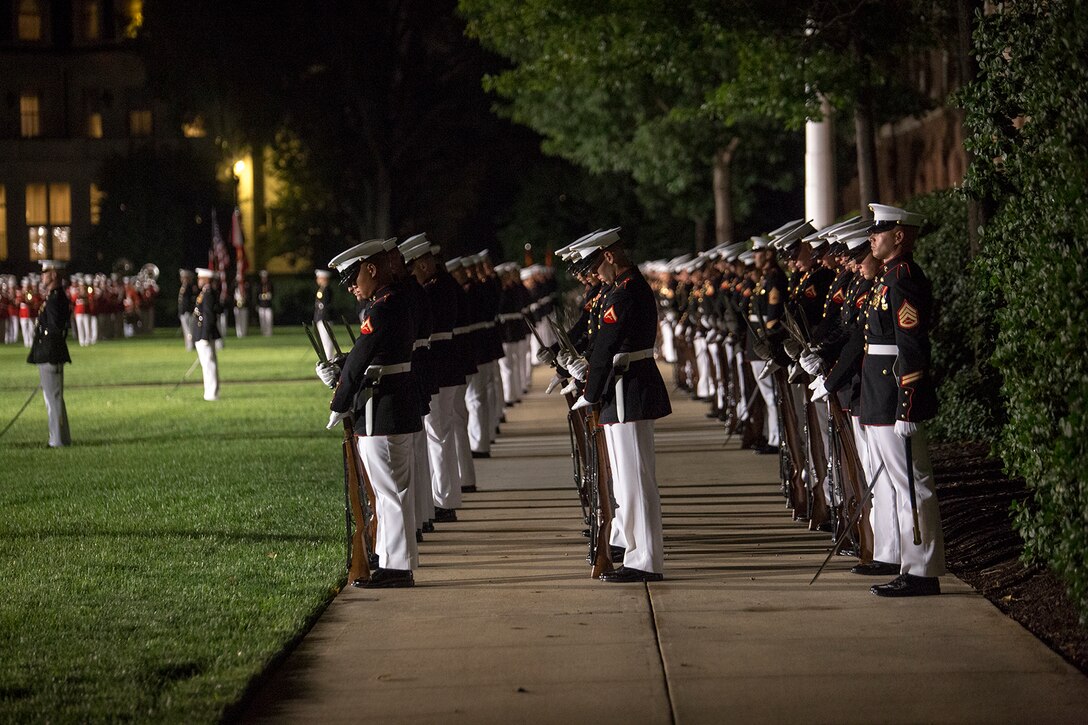 Marines of the marching companies, Marine Barracks Washington D.C., execute “fixed bayonets” during a Friday Evening Parade at the Barracks, Aug. 18, 2017. The guest of honor for the parade was the Superintendent of the U.S. Naval Academy, Vice Adm. Walter E. Carter, Jr., and the hosting official was the Deputy Commandant, Combat Development and Integration Commanding General, Marine Corps Combat Development Command, Lt. Gen. Robert S. Walsh. (Official Marine Corps photo by Lance Cpl. Damon McLean/Released)